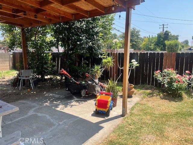 1550 W 21st St, San Bernardino, CA 92411 - fenced backyard featuring a patio