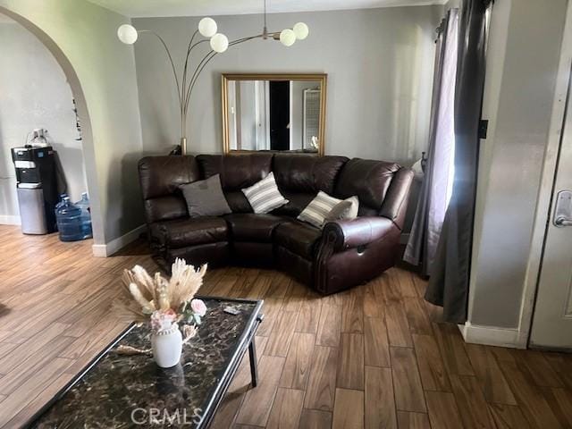 1550 W 21st St, San Bernardino, CA 92411 - living room with arched walkways and wood finished floors
