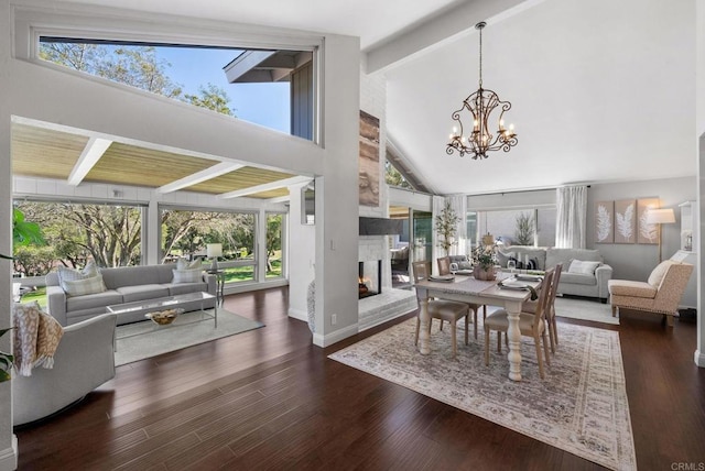 1247 La Casa Dr, San Marcos, CA 92078 - dining area featuring beam ceiling, a chandelier, a multi sided fireplace, wood finished floors, and high vaulted ceiling