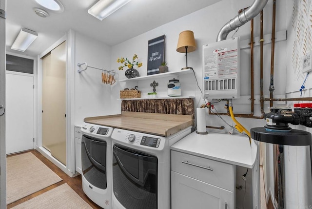 1247 La Casa Dr, San Marcos, CA 92078 - washroom with independent washer and dryer, cabinet space, and wood finished floors