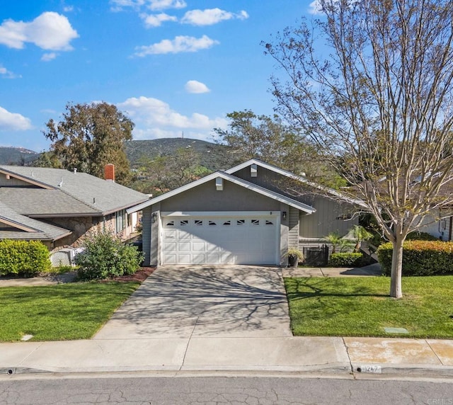 1247 La Casa Dr, San Marcos, CA 92078 - ranch-style house featuring a garage, a front lawn, concrete driveway, and a mountain view