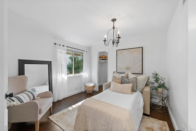 1247 La Casa Dr, San Marcos, CA 92078 - bedroom featuring a chandelier, wood finished floors, a walk in closet, and a closet