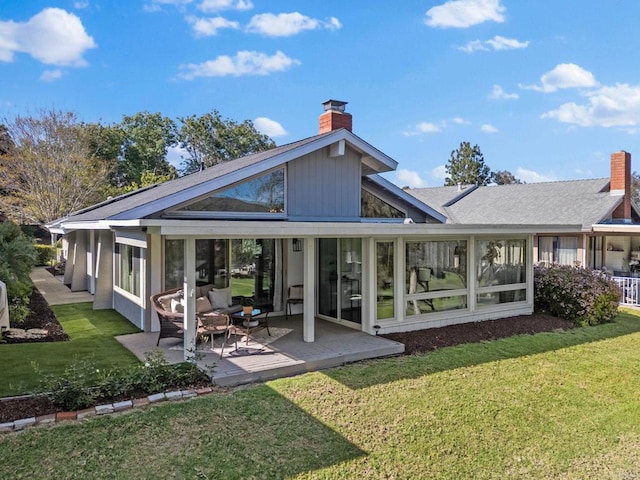 1247 La Casa Dr, San Marcos, CA 92078 - back of property featuring a chimney, a yard, a sunroom, a patio area, and a shingled roof