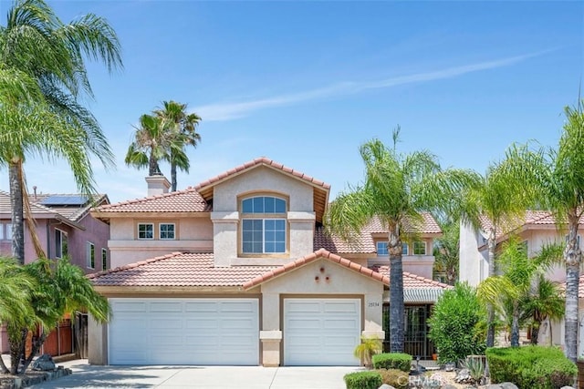 25134 Calle Viejo, Murrieta, CA 92563 - view of front of house with stucco siding, concrete driveway, a tile roof, a chimney, and an attached garage