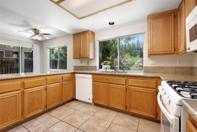 25134 Calle Viejo, Murrieta, CA 92563 - kitchen featuring white appliances, plenty of natural light, and light tile patterned floors