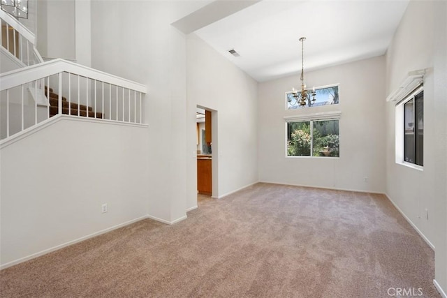 25134 Calle Viejo, Murrieta, CA 92563 - carpeted spare room with a chandelier, stairway, and a high ceiling