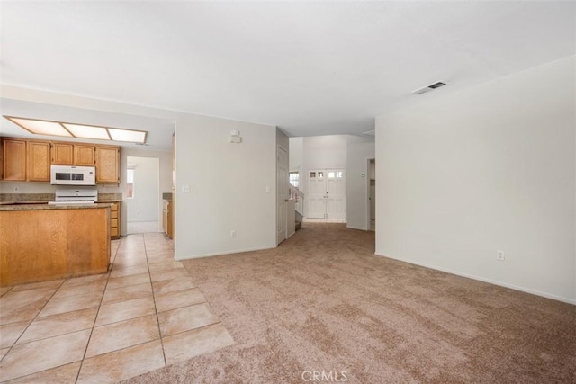 25134 Calle Viejo, Murrieta, CA 92563 - unfurnished living room with baseboards and light carpet