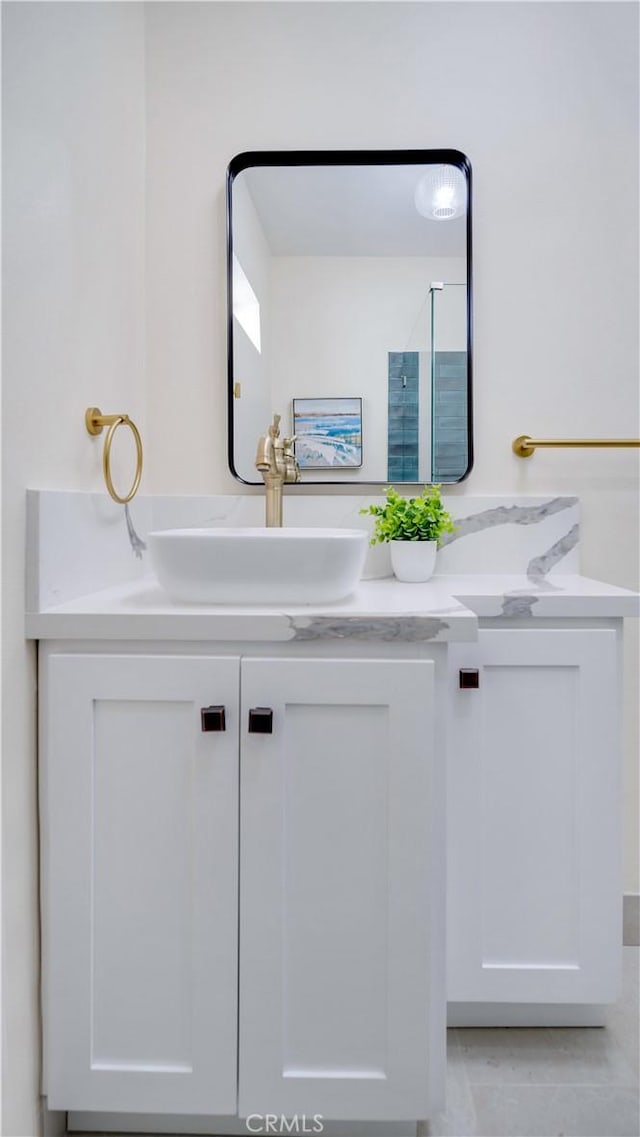815 N Hagar St, San Fernando, CA 91340 - bathroom featuring double vanity and tile patterned floors