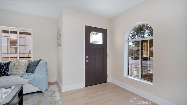 815 N Hagar St, San Fernando, CA 91340 - foyer with baseboards and light wood-style floors