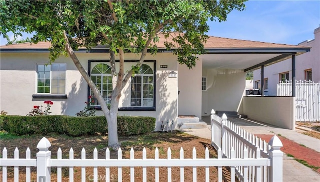 815 N Hagar St, San Fernando, CA 91340 - view of front facade with stucco siding and a fenced front yard