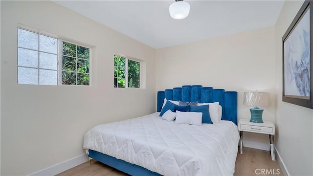 815 N Hagar St, San Fernando, CA 91340 - bedroom with baseboards and wood finished floors