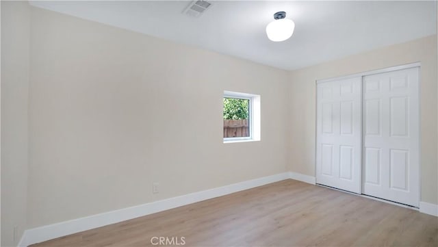 815 N Hagar St, San Fernando, CA 91340 - unfurnished bedroom featuring light wood-style floors and a closet