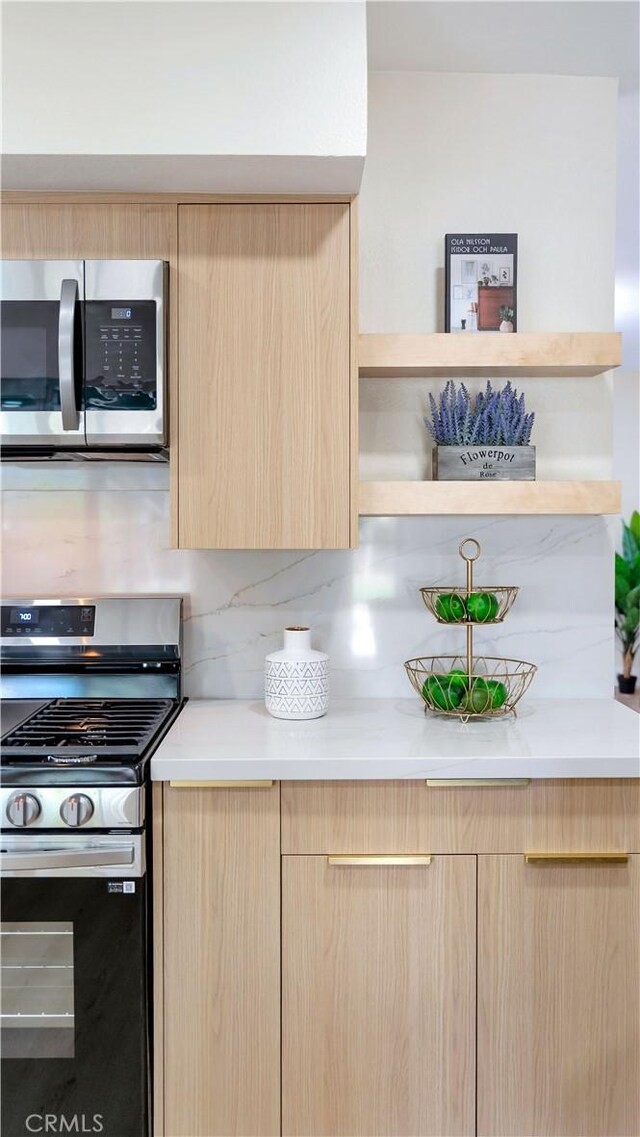 815 N Hagar St, San Fernando, CA 91340 - kitchen with light brown cabinets, stainless steel appliances, and modern cabinets