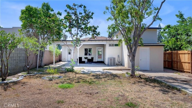 815 N Hagar St, San Fernando, CA 91340 - rear view of house with stucco siding, a fenced backyard, and a patio