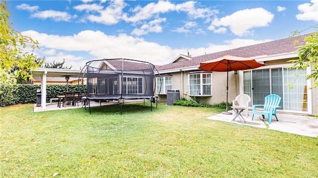 937 Dahlia Ave, Costa Mesa, CA 92626 - view of grassy yard with a trampoline and a patio area