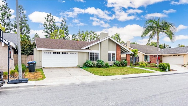937 Dahlia Ave, Costa Mesa, CA 92626 - view of front of house featuring an attached garage, driveway, and a chimney