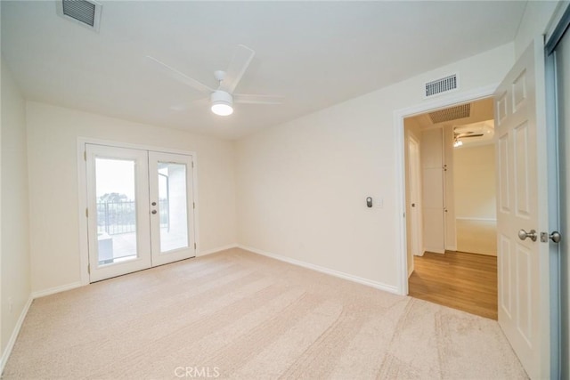 2648 Condor Cir, Corona, CA 92882 - carpeted empty room with a ceiling fan and french doors