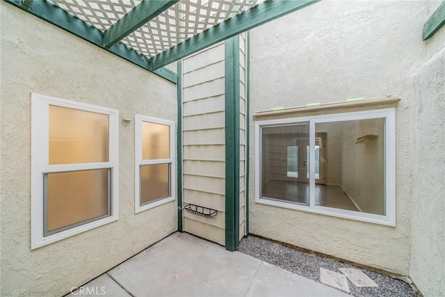 2648 Condor Cir, Corona, CA 92882 - property entrance with stucco siding and a pergola
