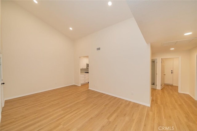 2648 Condor Cir, Corona, CA 92882 - unfurnished room featuring light wood-style floors, recessed lighting, and high vaulted ceiling
