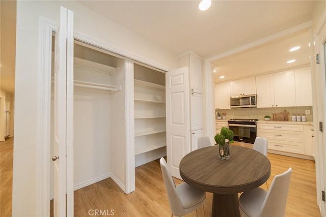 2648 Condor Cir, Corona, CA 92882 - dining room with light wood finished floors and recessed lighting