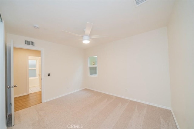 2648 Condor Cir, Corona, CA 92882 - spare room with light colored carpet and ceiling fan
