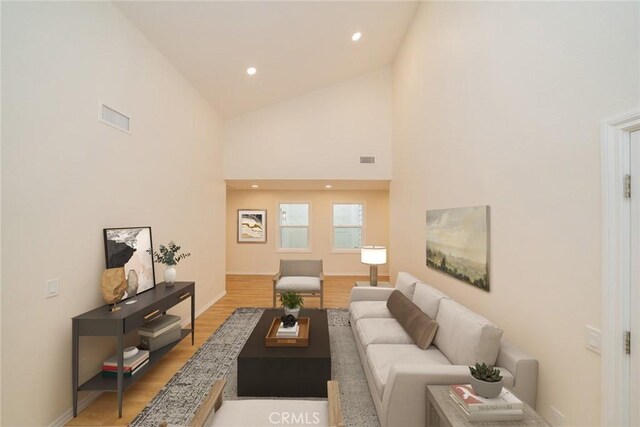 2648 Condor Cir, Corona, CA 92882 - living room with light wood-style floors, high vaulted ceiling, and recessed lighting