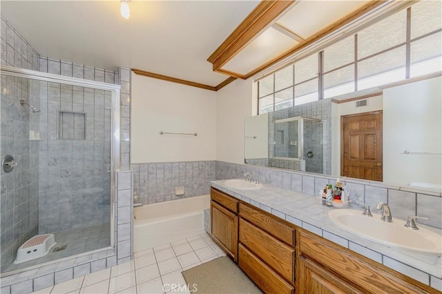 2837 E Mesa Dr, West Covina, CA 91791 - full bathroom featuring tile patterned flooring, a shower stall, a garden tub, double vanity, and ornamental molding