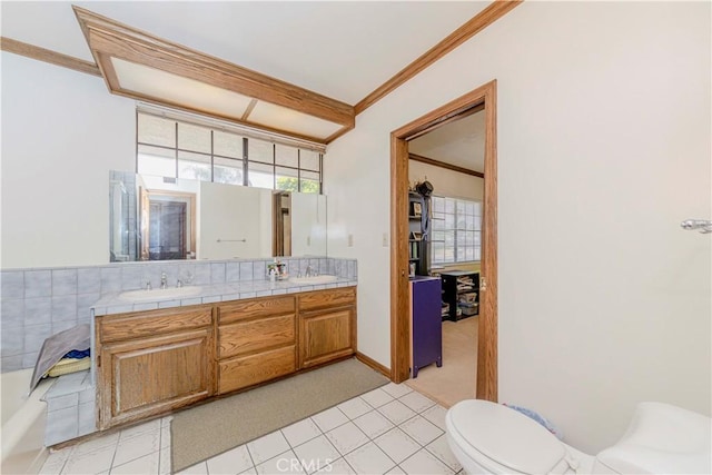 2837 E Mesa Dr, West Covina, CA 91791 - bathroom featuring double vanity, ornamental molding, and a tub