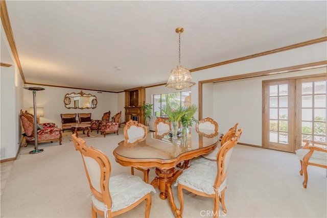 2837 E Mesa Dr, West Covina, CA 91791 - dining room featuring ornamental molding, light colored carpet, a chandelier, and healthy amount of natural light