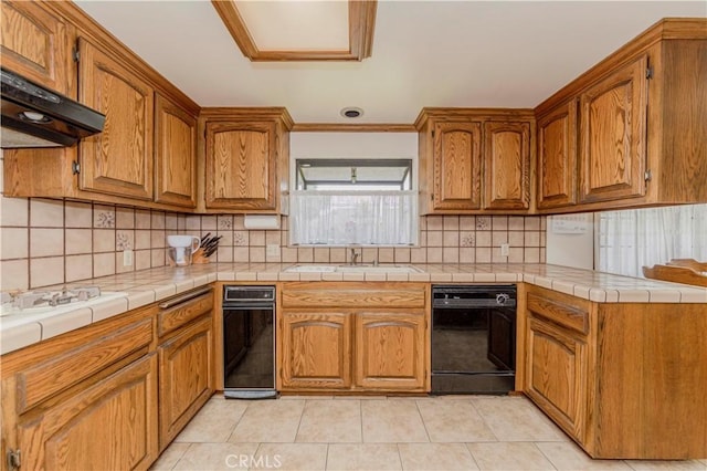2837 E Mesa Dr, West Covina, CA 91791 - kitchen featuring black dishwasher, under cabinet range hood, brown cabinetry, backsplash, and ornamental molding