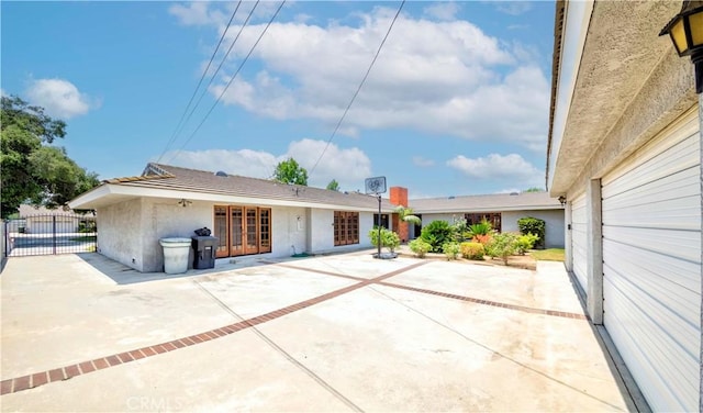 2837 E Mesa Dr, West Covina, CA 91791 - rear view of house featuring stucco siding, a patio area, and french doors