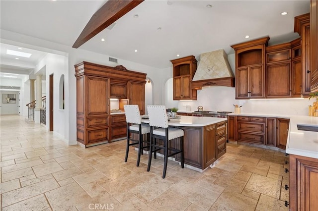 6337 Via Colinita, Rancho Palos Verdes, CA 90275 - kitchen with custom range hood, stone tile floors, a center island, light countertops, and recessed lighting