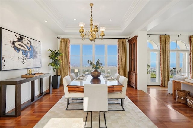 6337 Via Colinita, Rancho Palos Verdes, CA 90275 - dining space with a chandelier, dark wood-type flooring, a raised ceiling, crown molding, and recessed lighting