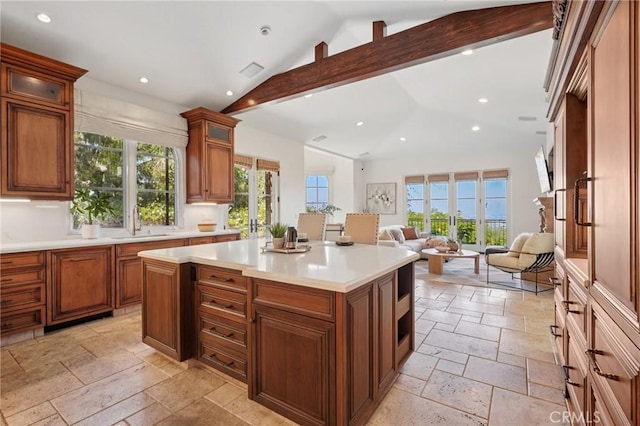 6337 Via Colinita, Rancho Palos Verdes, CA 90275 - kitchen featuring stone tile floors, recessed lighting, light countertops, and glass insert cabinets