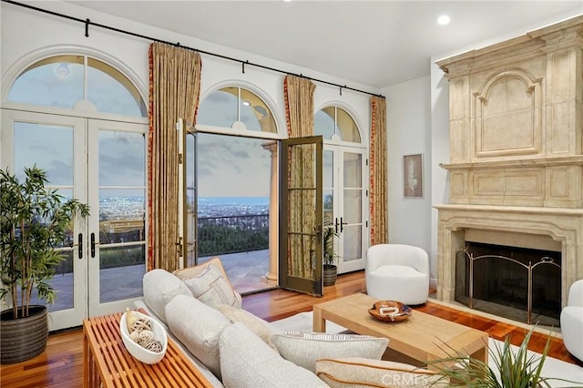 6337 Via Colinita, Rancho Palos Verdes, CA 90275 - living room with french doors, wood finished floors, recessed lighting, and a fireplace with raised hearth