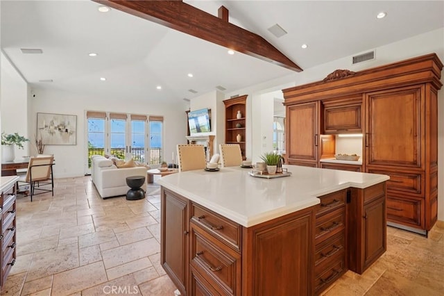 6337 Via Colinita, Rancho Palos Verdes, CA 90275 - kitchen with stone tile flooring, open floor plan, light countertops, recessed lighting, and brown cabinets