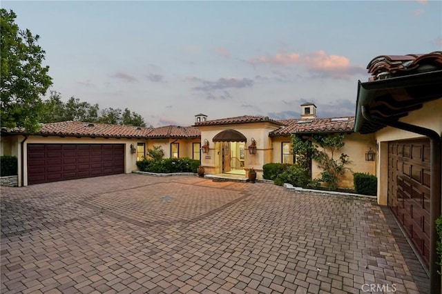 6337 Via Colinita, Rancho Palos Verdes, CA 90275 - mediterranean / spanish-style home with stucco siding, an attached garage, decorative driveway, a chimney, and a tile roof