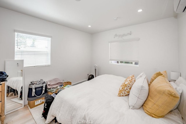 25252 Atwood Blvd, Newhall, CA 91321 - bedroom with a wall mounted air conditioner, light wood-type flooring, and recessed lighting