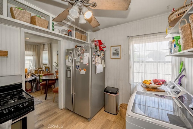 25252 Atwood Blvd, Newhall, CA 91321 - kitchen with appliances with stainless steel finishes, washer / clothes dryer, light wood finished floors, ceiling fan, and ornamental molding