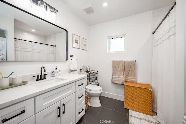 25252 Atwood Blvd, Newhall, CA 91321 - full bath featuring stacked washing machine and dryer, vanity, tile patterned flooring, recessed lighting, and a shower with curtain