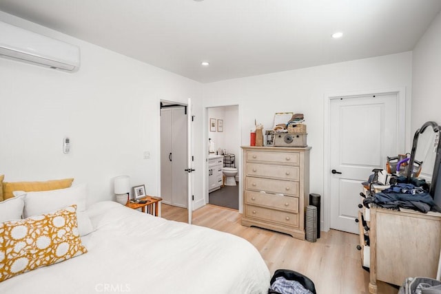 25252 Atwood Blvd, Newhall, CA 91321 - bedroom with a wall unit AC, light wood finished floors, recessed lighting, and connected bathroom