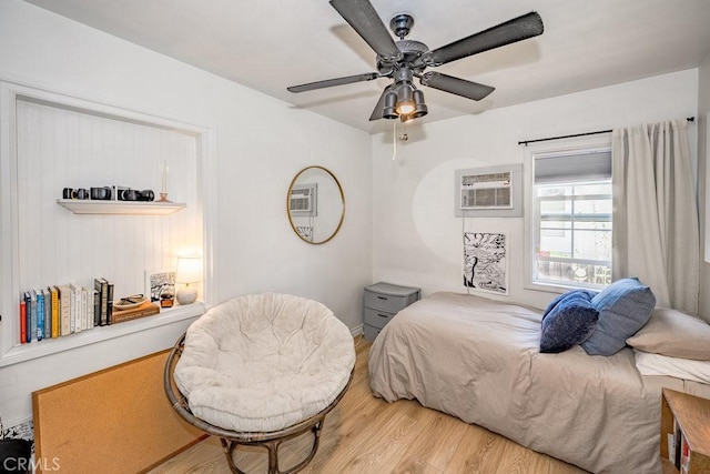 25252 Atwood Blvd, Newhall, CA 91321 - bedroom featuring wood finished floors, a wall mounted air conditioner, and a ceiling fan
