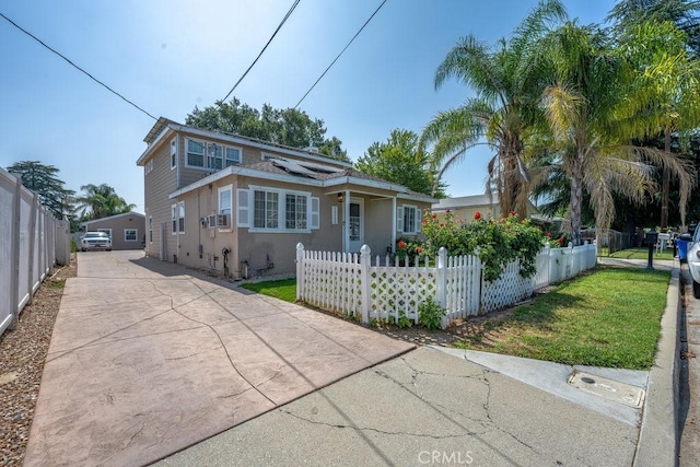 25252 Atwood Blvd, Newhall, CA 91321 - view of front of property with roof mounted solar panels, concrete driveway, and stucco siding