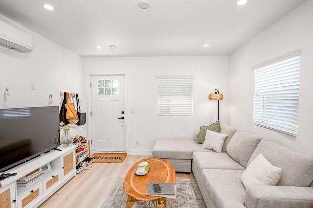 25252 Atwood Blvd, Newhall, CA 91321 - living area featuring an AC wall unit, light wood-type flooring, and recessed lighting