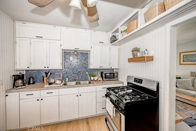 25252 Atwood Blvd, Newhall, CA 91321 - kitchen featuring appliances with stainless steel finishes, a ceiling fan, white cabinets, light countertops, and light wood-style floors