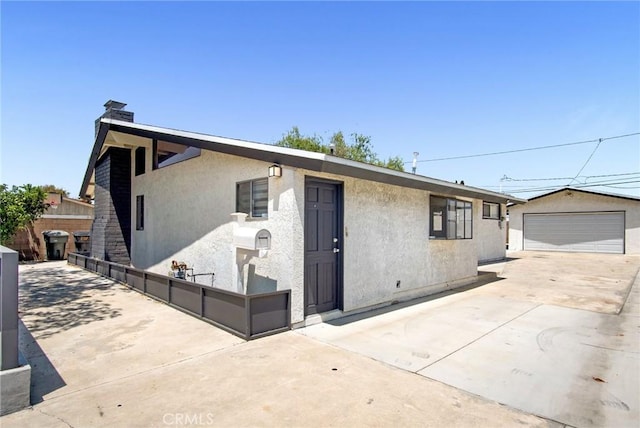 10632 Larry Dr, Anaheim, CA 92804 - view of front facade with stucco siding, an outbuilding, and a detached garage