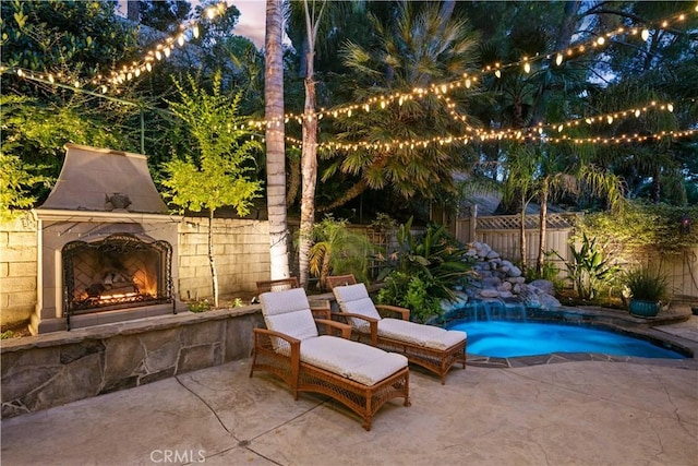 18836 Cedar Valley Way, Newhall, CA 91321 - view of patio / terrace featuring an outdoor stone fireplace