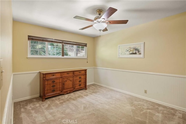 18836 Cedar Valley Way, Newhall, CA 91321 - empty room featuring wainscoting, carpet, and a ceiling fan