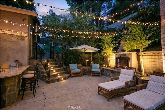 18836 Cedar Valley Way, Newhall, CA 91321 - view of patio / terrace with an outdoor stone fireplace