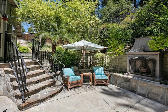 18836 Cedar Valley Way, Newhall, CA 91321 - view of patio / terrace featuring an outdoor fireplace and stairs